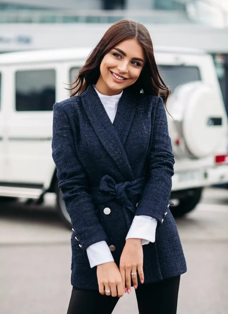 Smiling pretty lady posing in the city