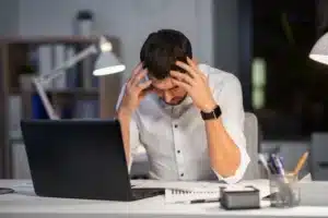 Stressed person working late at night.