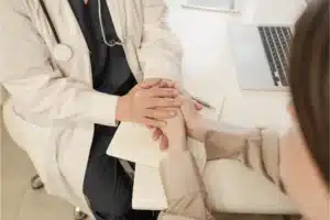 Healthcare provider offering emotional support and guidance to a patient during substance abuse treatment.