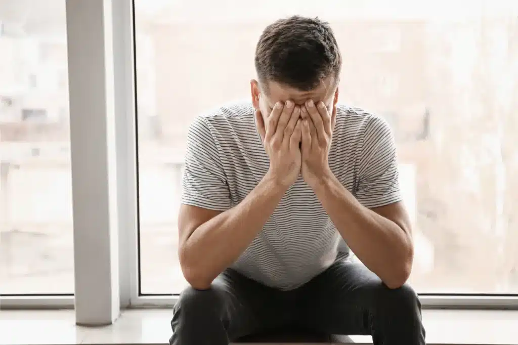 Man struggling with mental health and substance use recovery challenges,