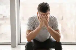 Man struggling with mental health and substance use recovery challenges,
